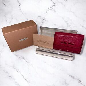 MIU MIU FUSHIA TRIFOLD COMPACT WALLET